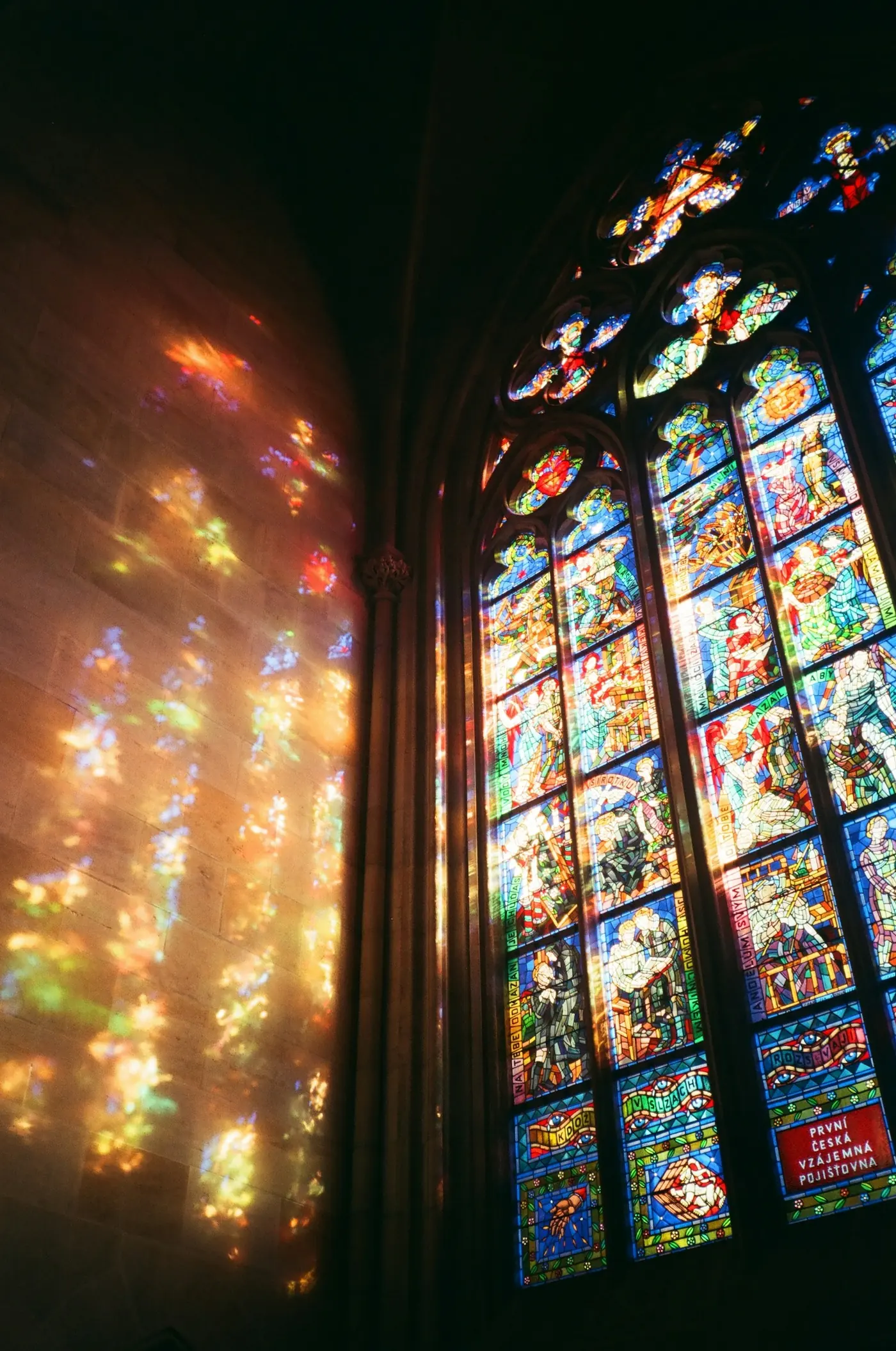 Sunlight streaming through a stained glass window