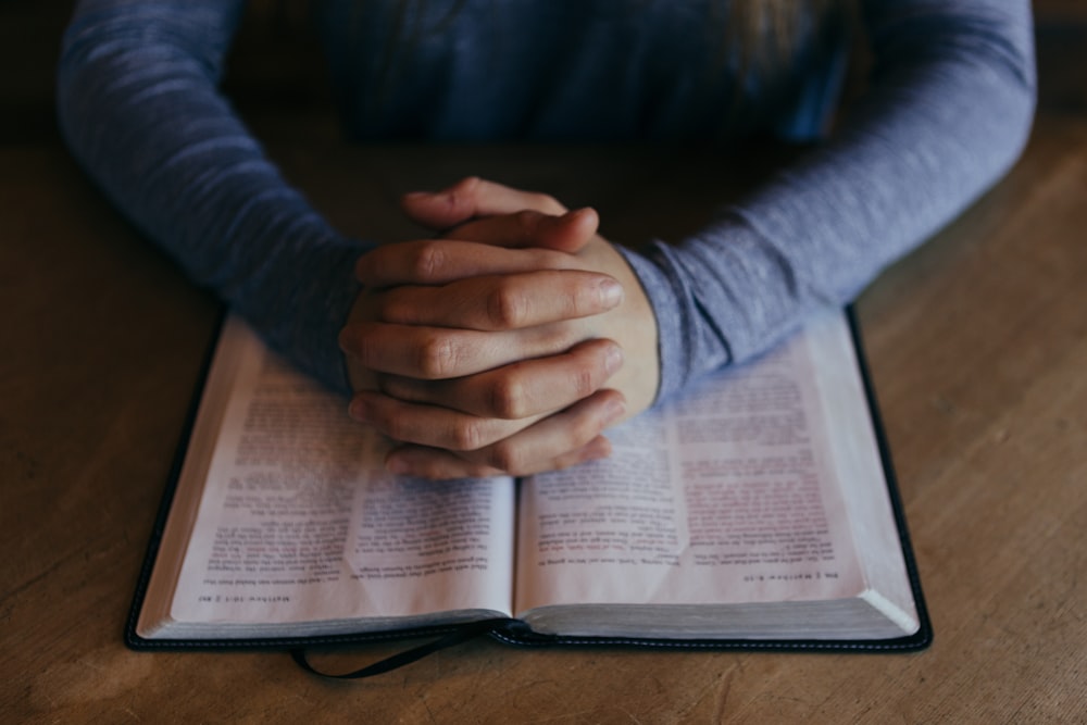 An open Bible being read during worship