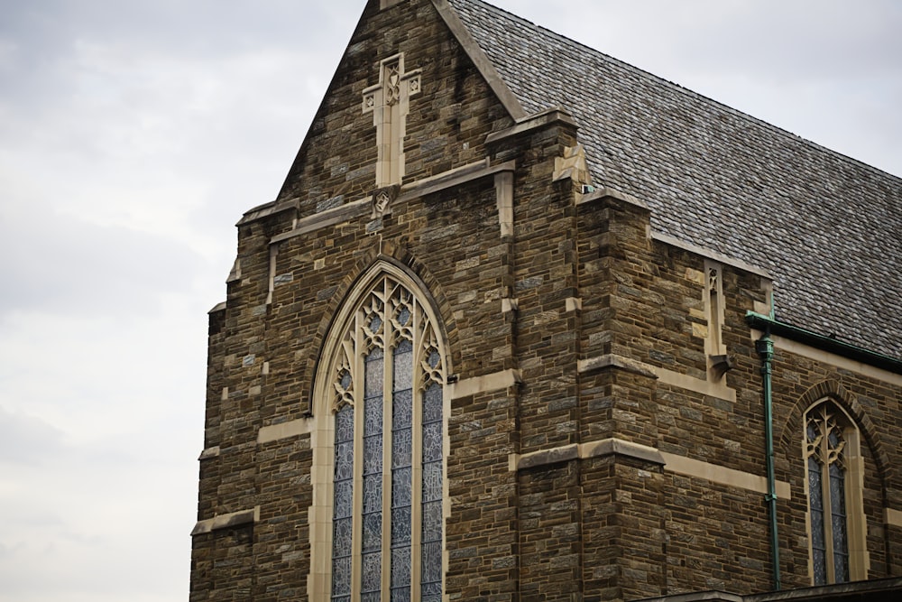 Historic stone Anglican church building with a cross