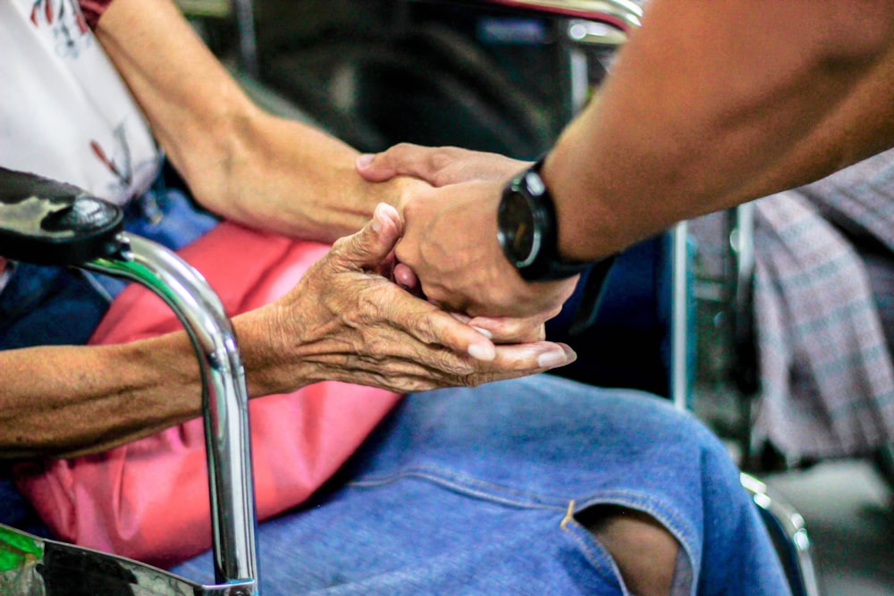 Hands held in care and companionship
