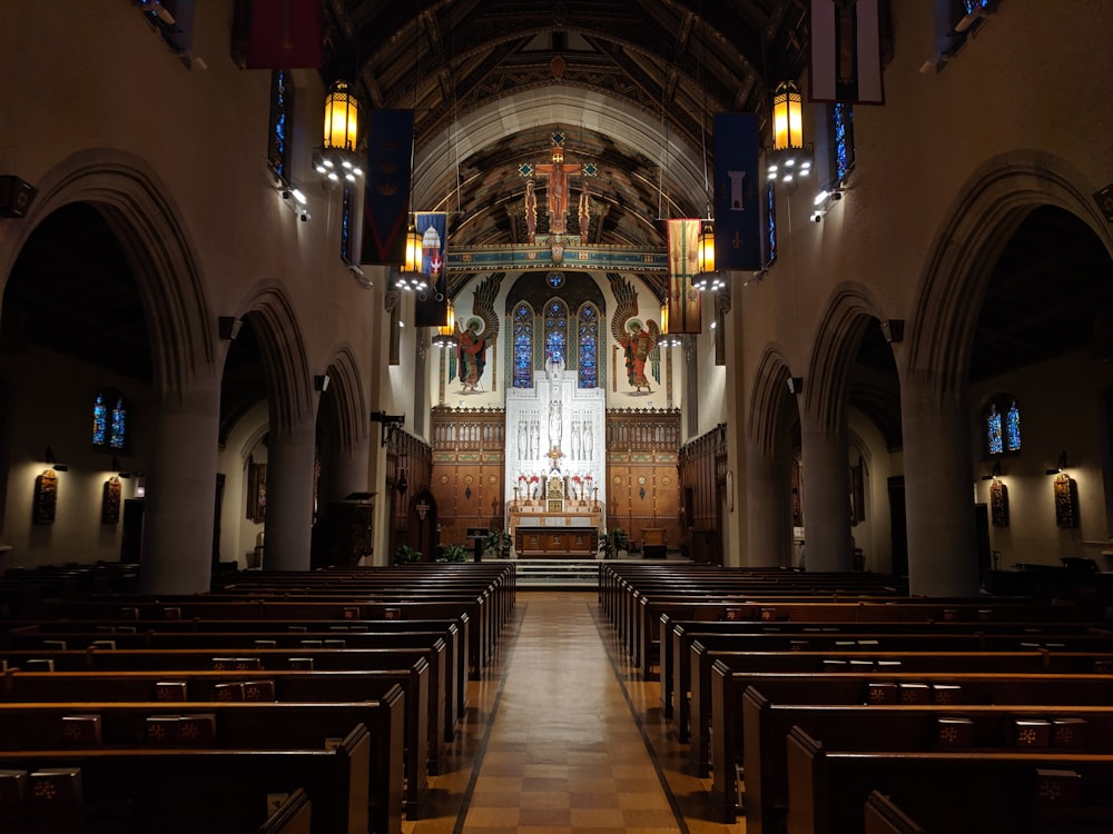 Church interior with pews and stained glass windows